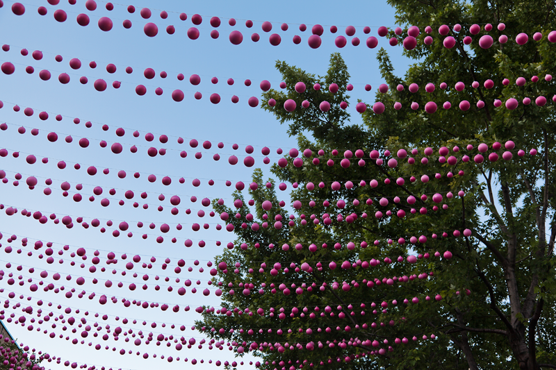 Pink balls form a canopy over Rue Ste-Catherine in Montreal