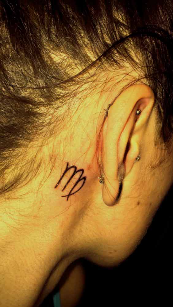 Small Virgo zodiac symbol tattoo design behind the ear