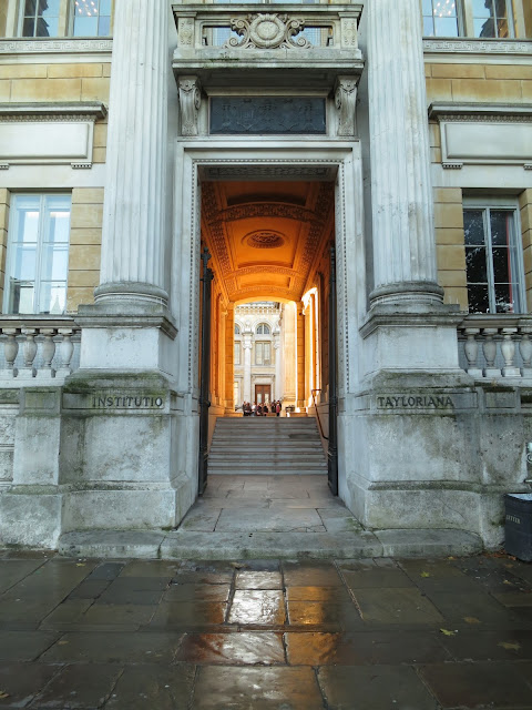 Ashmolean Museum, Oxford. Light from the courtyard spilling down some steps onto the street