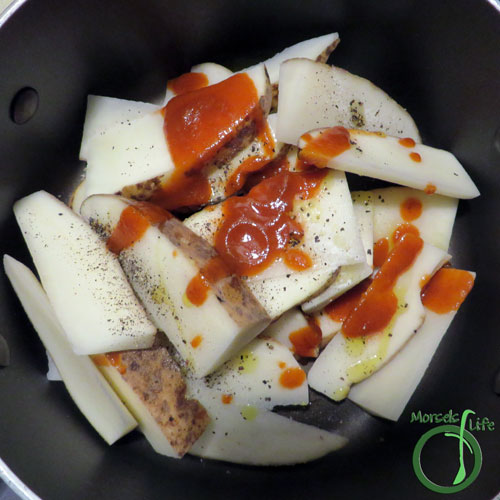 Morsels of Life - Sriracha Potato Wedges Step 2 - Combine all materials, making sure to coat potato wedges well.