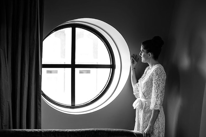 Real bride wearing our Kate french lace robe while getting ready