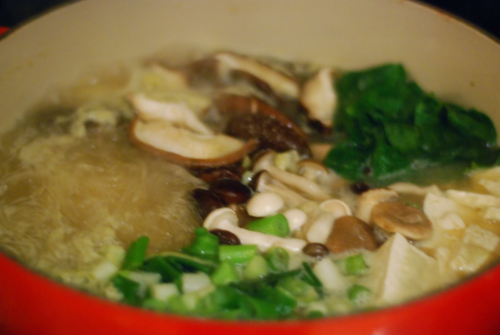 cup and table tofu and mushroom miso hot pot