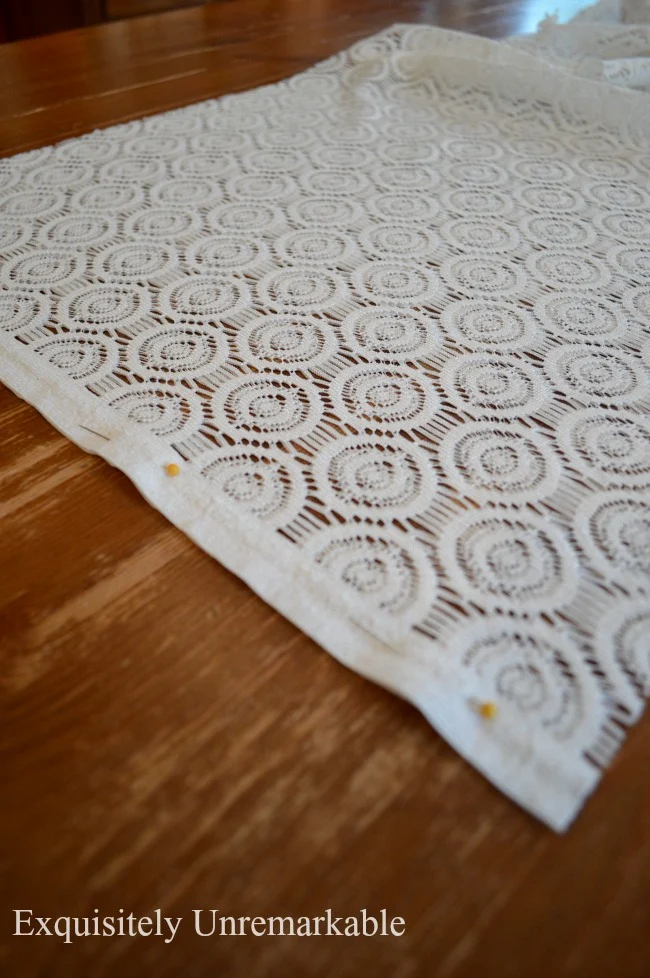 Pinning lace fabric to seam it