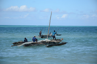 jambiani beach in zanzibar, boats with rocker while sailing to the reef