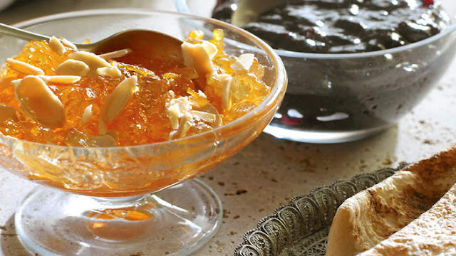 Bitter orange marmalade with rosewater and almonds in a bowl