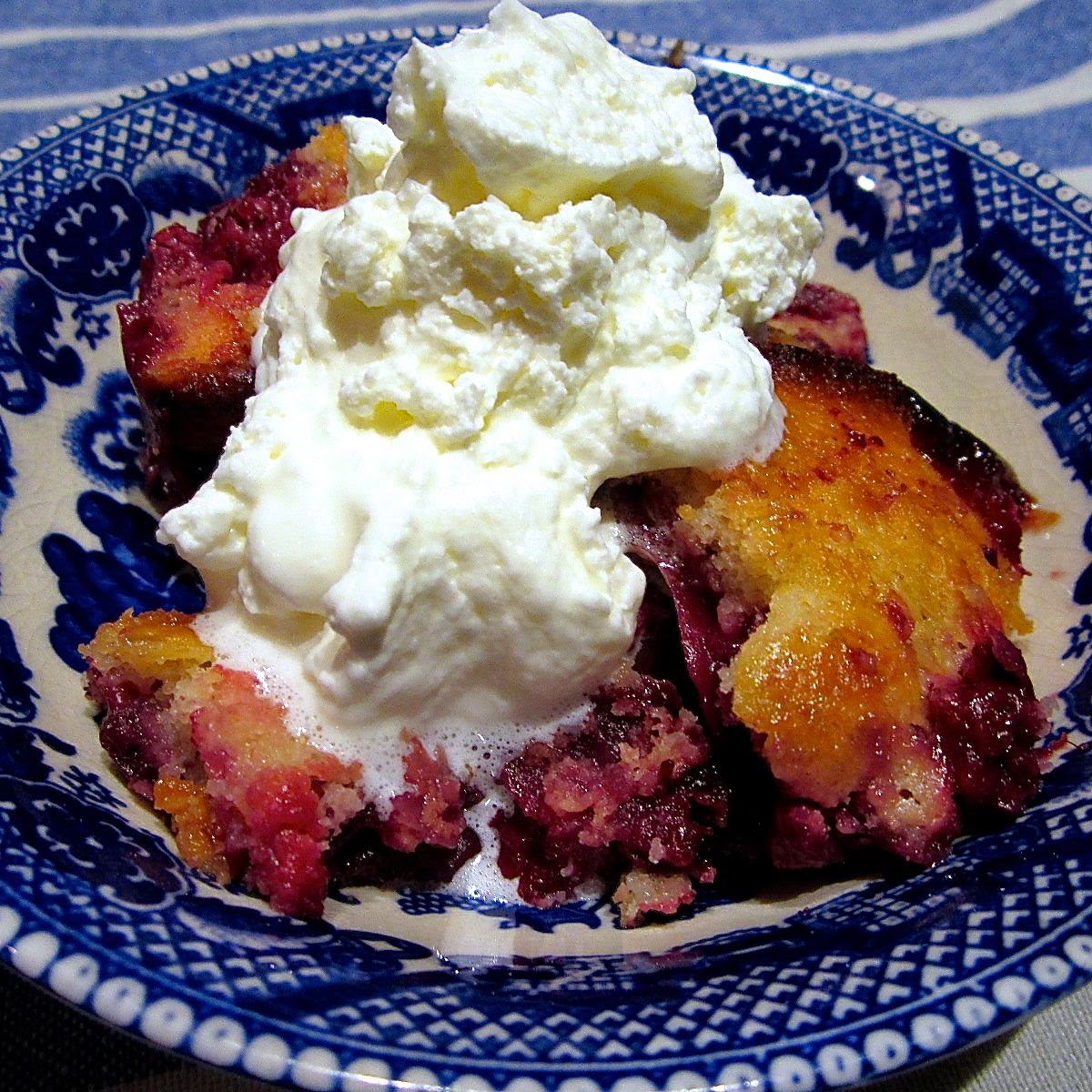 mixed berry cobbler with whipped cream