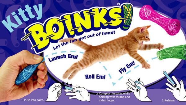 Kitty boinks cat toy