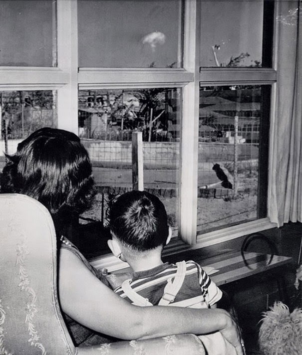 40 Must-See Photos Of The Past - Mom and son watching the mushroom cloud after an atomic test, Las Vegas, 1953