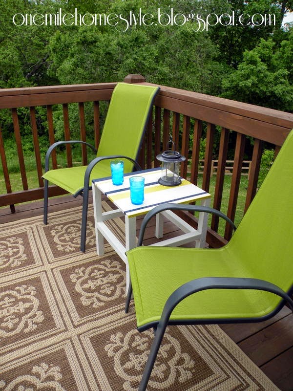 Outdoor living space with green chairs