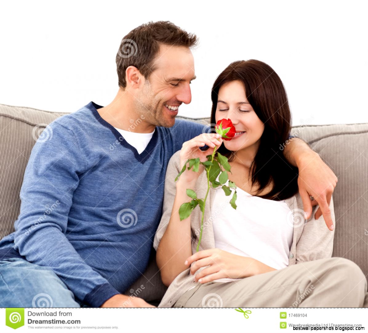 Lovely Man Looking At His Wife Smelling A Red Rose Stock Images