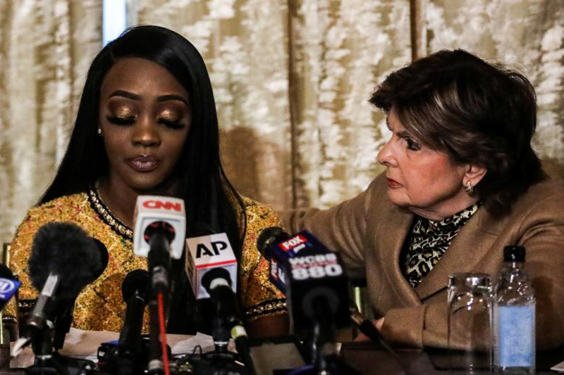 Faith Rodgers reacts as she reads a statement to reporters with attorney Gl...