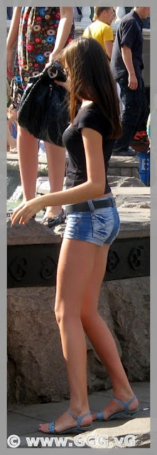 Skinny girl wearing micro jeans shorts