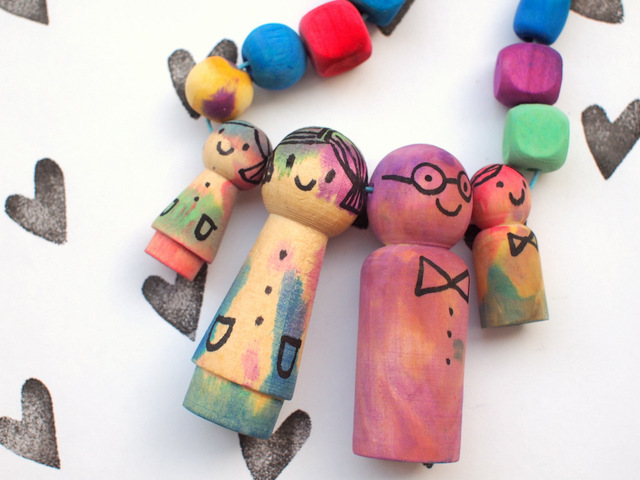 how to make a cute family necklace from wooden peg dolls and beads dyed by liquid watercolors