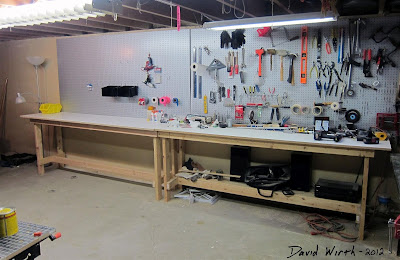 great basement workshop, woodshop, bench, tool peg board