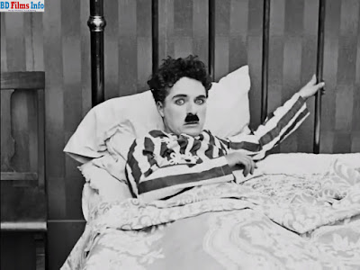 Sir Charles Chaplin in The Adventurer (1917)_BD Films Info Sir Charles Chaplin in The Adventurer (1917) The adventurer is an American short comedy and silent era film written and directed by Charles Chaplin in 1917. It is a silent era film but its music helps it to fill up the lack of its dialogue. The film is produced by John Jasper and its cinematographers are Roland Totheroh and George Zalibra. The film is edited by Sir Charles Chaplin himself. The main character of the film is also Charles Chaplin. Besides, the leading characters are Henry Bergman, Marta Golden, Edna Purviance, Eric Campbell. The main theme of the film is; Charles Chaplin as a little tramp runs away from jail. The police are finding him beside the seashore. Charles Chaplin, at any cost, escapes him from the situation and hears a drowning woman’s crying in the water. At last he escapes Edna Purviance and the drowning woman Marta Golden and Eric Campbell with the help of associates. Edna Purviance in The Adventurer (1917) Short Film But Eric Campbell falls down again. Charles again tries to have lifted him but Eric Campbell does not give any chance to lift on from water. But Charles becomes astonished seeing himself on the hospital bed wearing his former jail dress. Eric cannot tolerate Charles and Edna’s closeness. He finds criminal Charles’s photo in newspaper and phones to the police. The police come but in the swank party, through his funny activities, he escapes himself from the police and runs away. The film is in fully funny activities of Charles Chaplin. But his acting is natural and skilled. This is a silent film but the background music helps it to cover the lack of its dialogues and upcoming events. Cinematography and editing style are very normal. Sir Charles Chaplin in The Adventurer (1917)