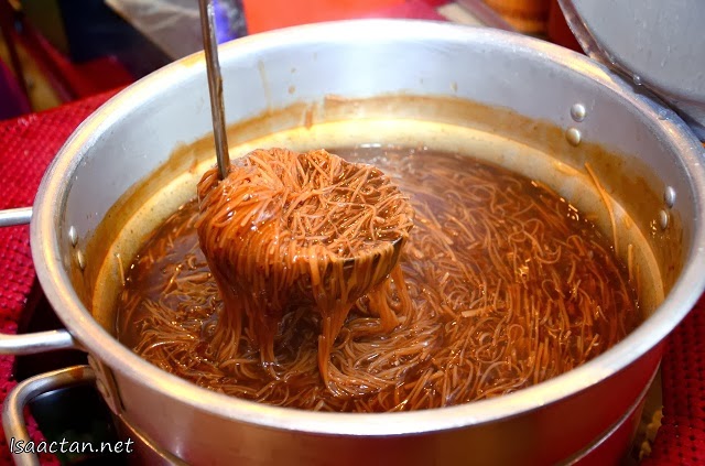Handmade Oyster Mee Sua being scooped fresh from the pot
