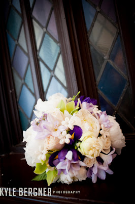 Lavendar, cream and purple bridal bouquet in window