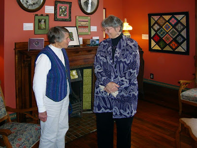 Robin Atkins with a visitor at the opening of Beadlust exhibition