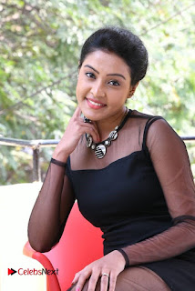 Actress Aswini Stills in Black Dress at Aavu Puli Madhyalo Prabhas Pelli Press Meet  0021
