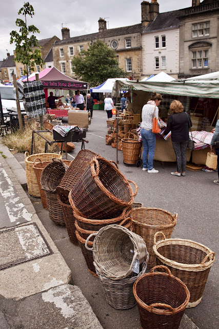 Market day at Chipping Norton with hand woven baskets for sale
