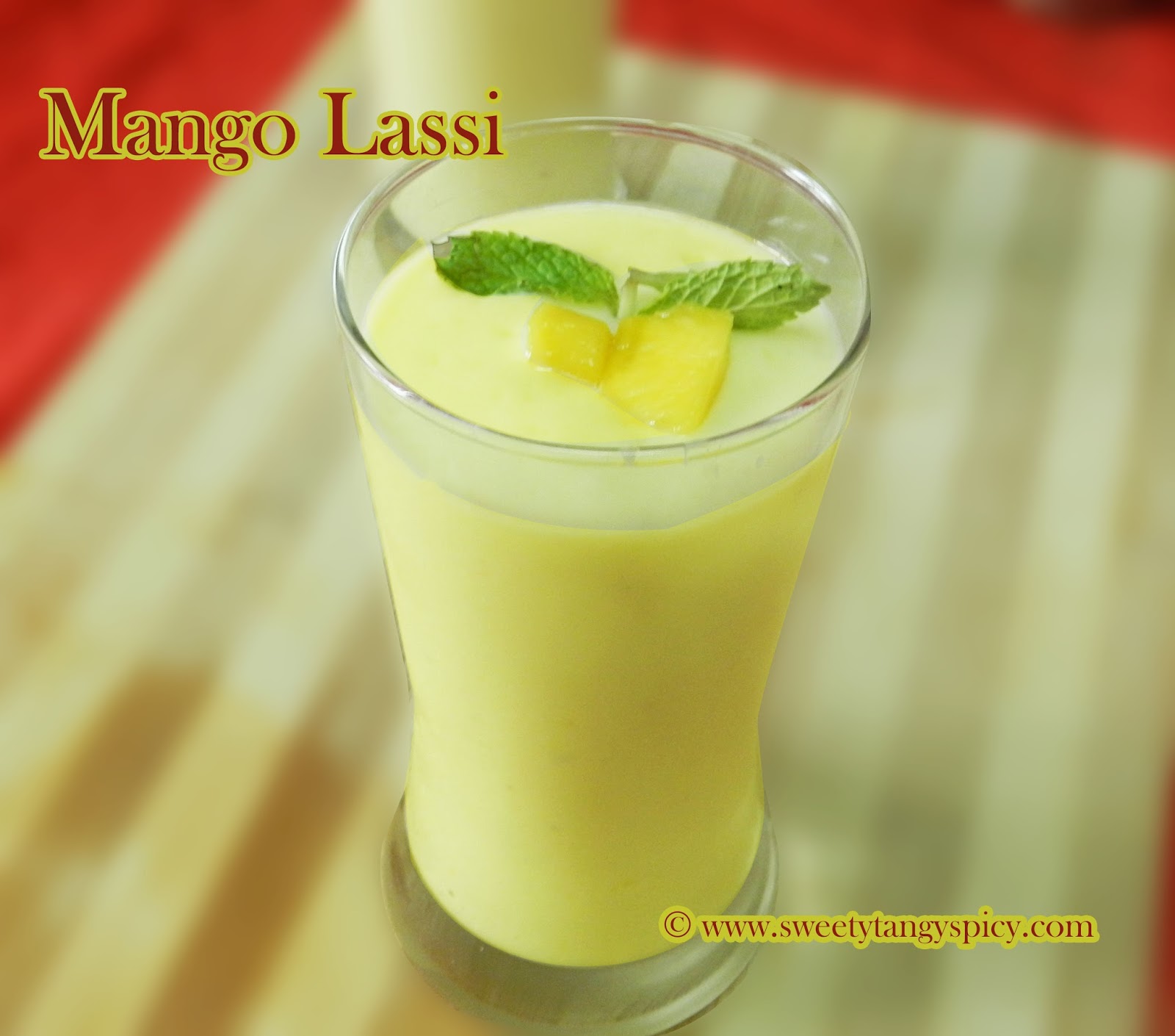 Mango lassi is ready. Transfer into glasses and garnish with mango pieces and mint leaves. Serve