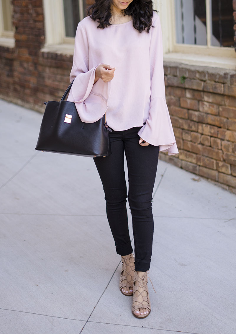 pink ruffled bell sleeve top black jeans and lace up sandals