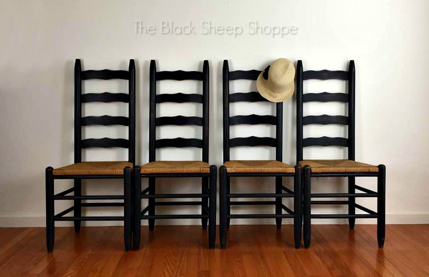 Four ladder back chairs staged with vintage hat. Four ladder back chairs staged with vintage hat.