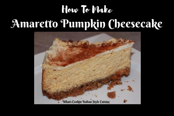 this is how to make Amaretto Pumpkin Cheesecake. This is a slice of the Amaretto Pumpkin Cheesecake on a white dish with graham cracker pecan cinnamon crust.