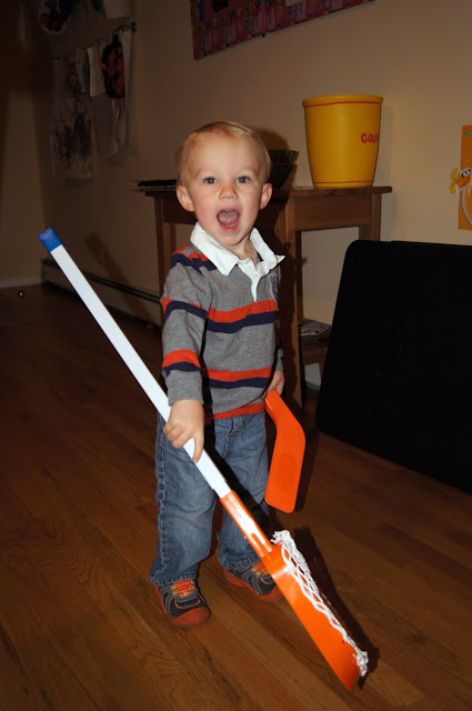 toddler with lacrosse stick