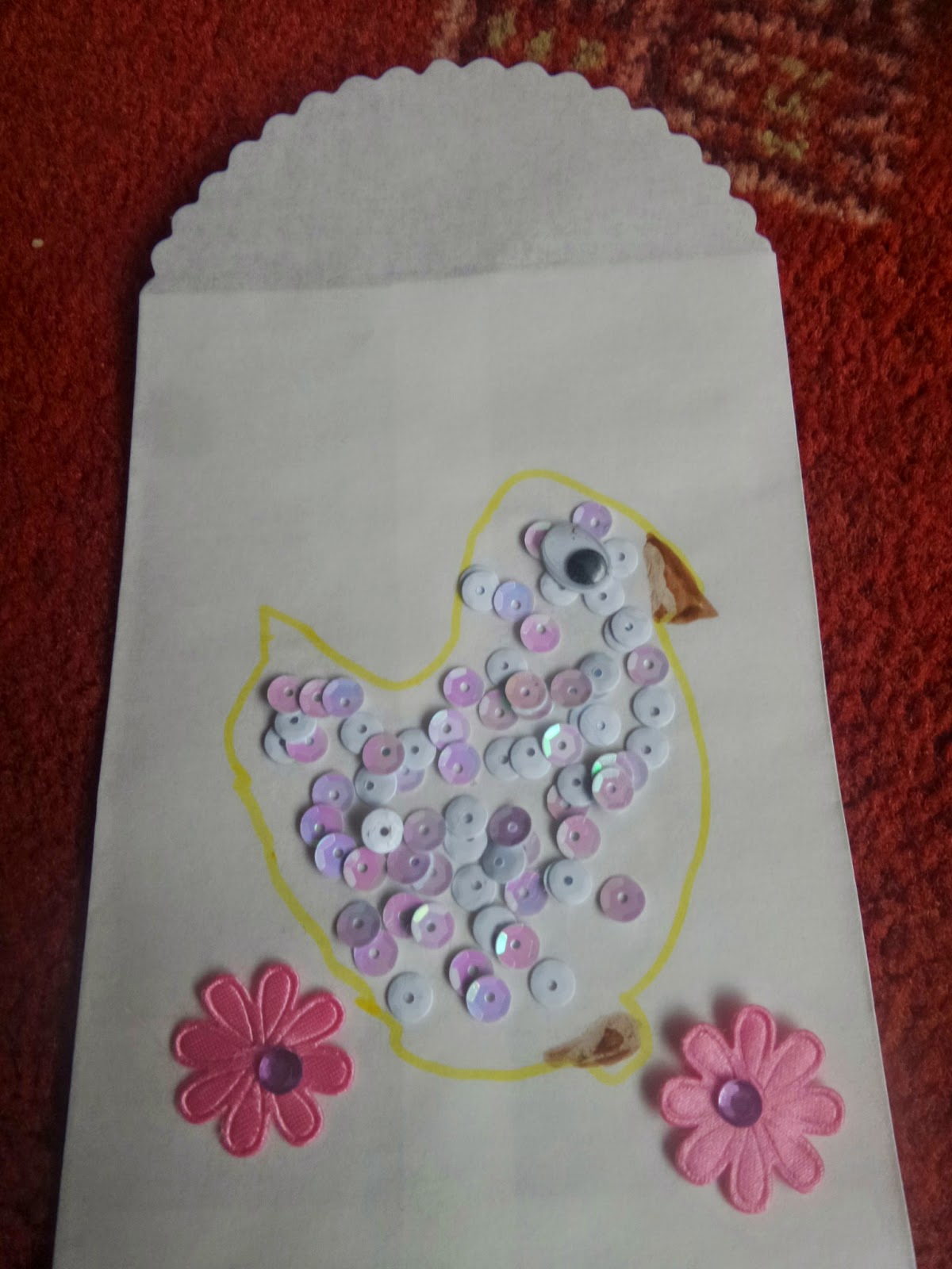 A sequined Chick on an envelope
