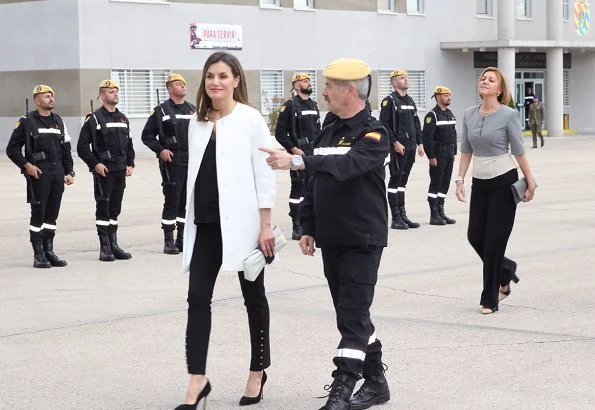 Queen Letizia wore Adolfo Dominguez coat, and Hugo Boss Heylen trousers. Letizia wore Pedro del Hierro dress 2017-18 collection. Magrit pumps