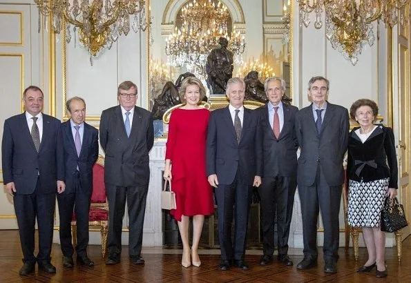 Queen Mathilde wore H&M Red Long Sleeve Ruffle Midi Dress. royal reception at the Royal Palace in Brussels. Edouard Vermeulen