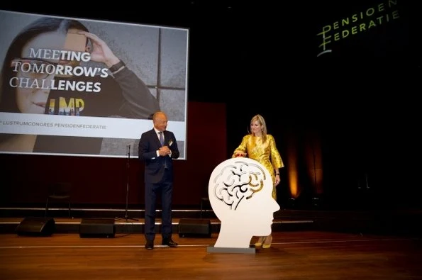 Queen Maxima opens the first anniversary congress of the Pension Federation. Queen Maxima wore Natan dress, Natan yellow Pumps, Natan Jeweles