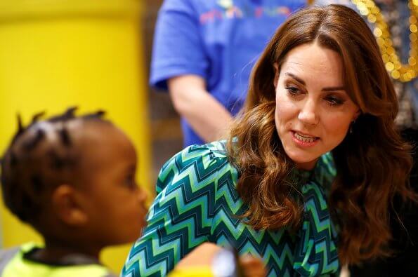 During the visit, Kate Middleton wore a new turquoise and navy print blouse by Tabitha Webb. Tabitha Webb Pansy pussybow in green chevron