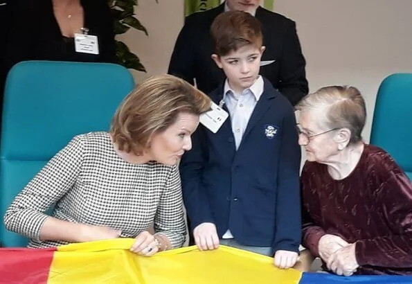 Queen Mathilde visited J and JOY in Waremme which is a clothing brand that is also socially and philanthropically active. Natan dress and camel cape