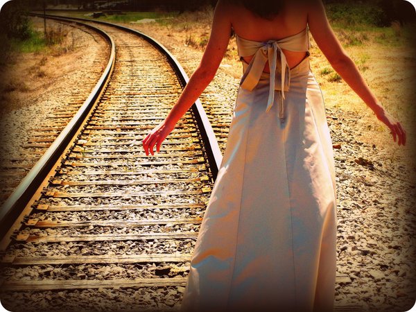 Alone Girl Walking On A Railway Track