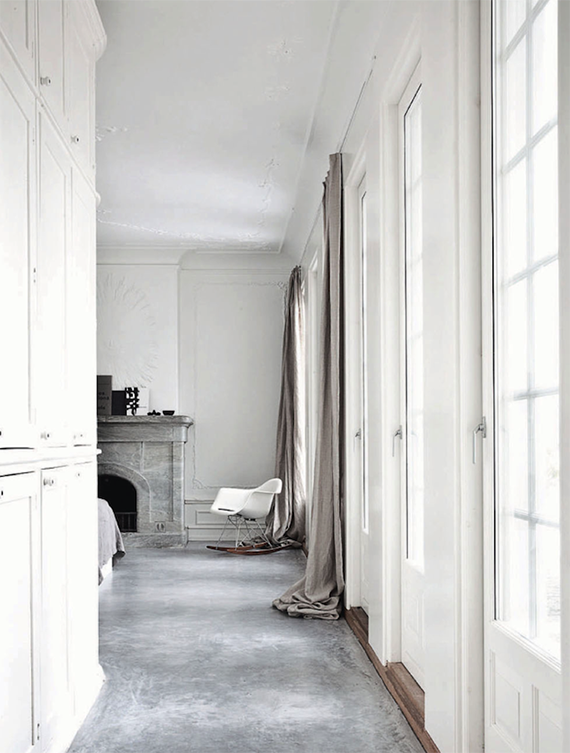 Bedroom with concrete floor. Norm Architects