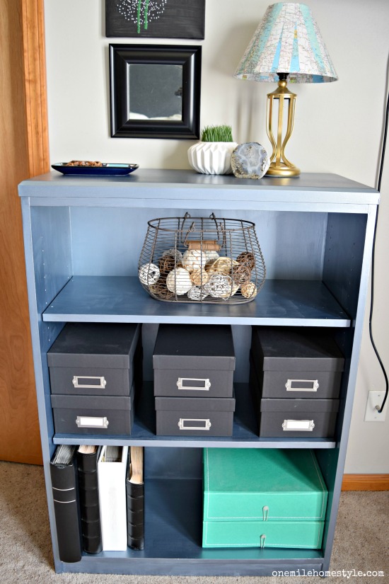 How to makeover a bookcase from boring to bold with blue metallic paint!
