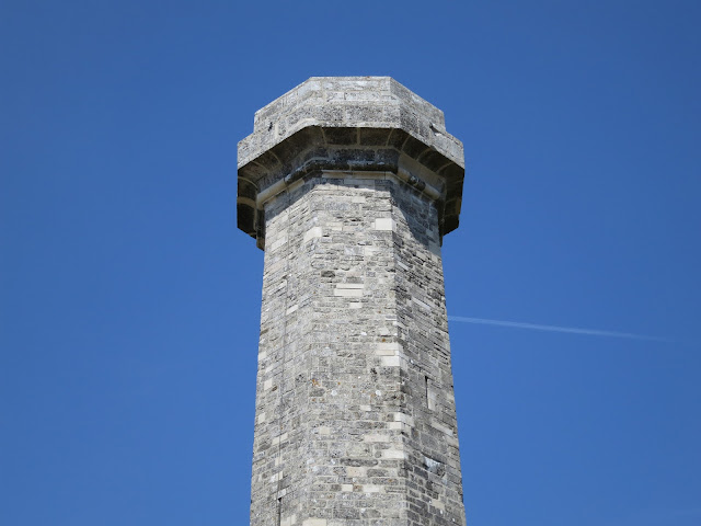 Hardy's Monument - stone pillar against blue sky.