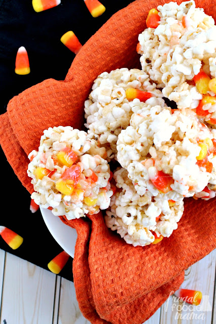 These sweet & salty Candy Corn Popcorn Krispie Balls are the perfect easy to make treat for a fall or Halloween celebration.