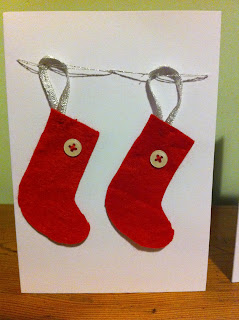 handmade christmas card with red felt stocking and white buttons
