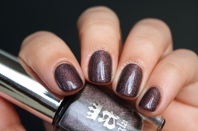 A-England Sleeping Palace Manicure Swatch on Short Nails Holding Bottle