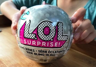 LOL Surprise Bling Series ball in girl's hands