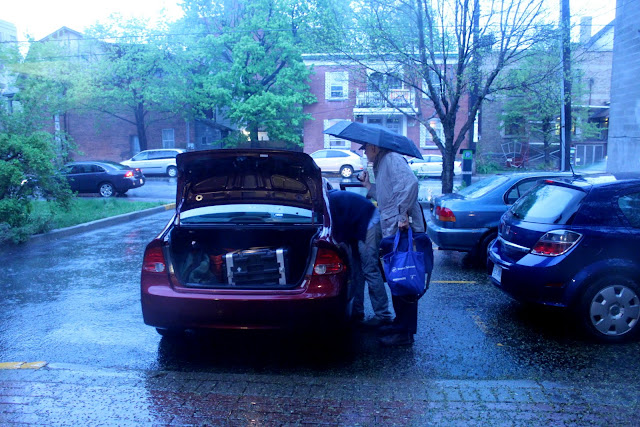 Unloading CD recording equipment in the Rain