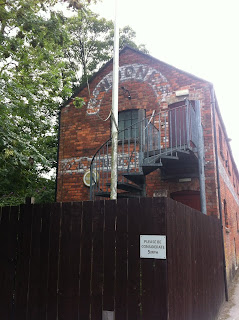 Ghost sign on old merchant's building in Nailsworth, Gloucestershire