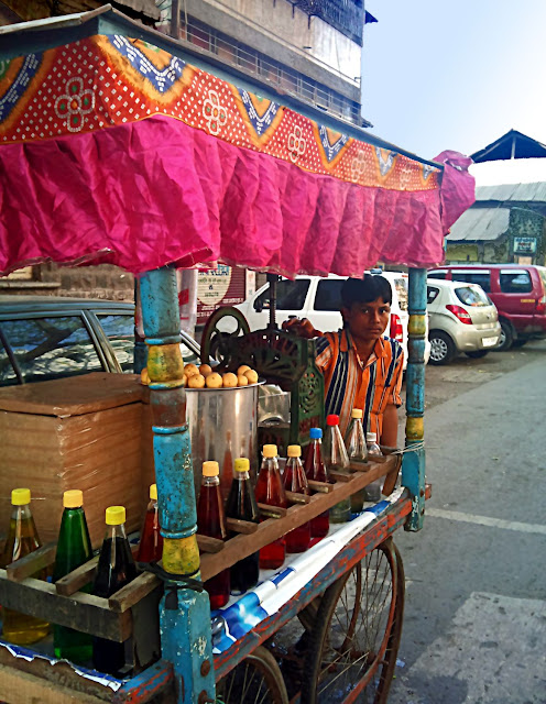 Boy vendor selling synthetic drinks