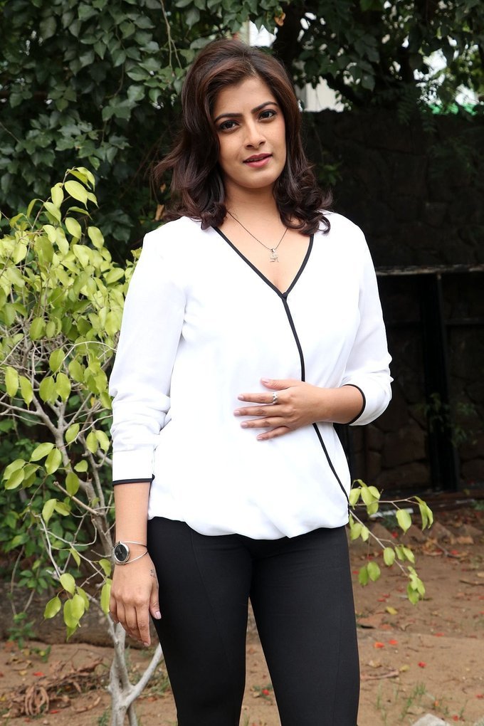 Beautiful Tamil Actress Varalaxmi Sarathkumar Long Hair In White Shirt Jeans