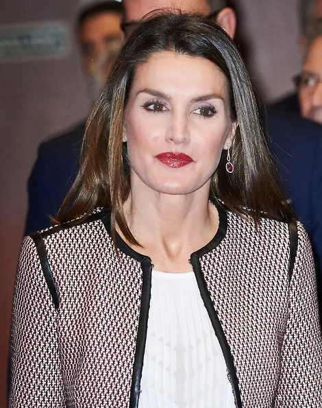 Queen Letizia wore Hugo Boss Keili Jacket and Meili Skirt, and wore Carolina Herrera black patent and suede pumps, and carried Carolina Herrera clutch