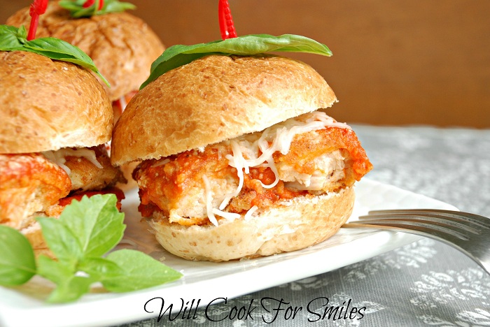 3 Chicken Parmesan Sliders on a white plate close up 