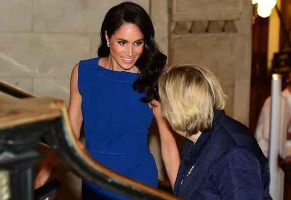 Meghan Markle wore a royal blue midi dress by Jason Wu, Aquazzura Portrait Lady pumps, she carries DIOR Navy Satin Clutch Bag